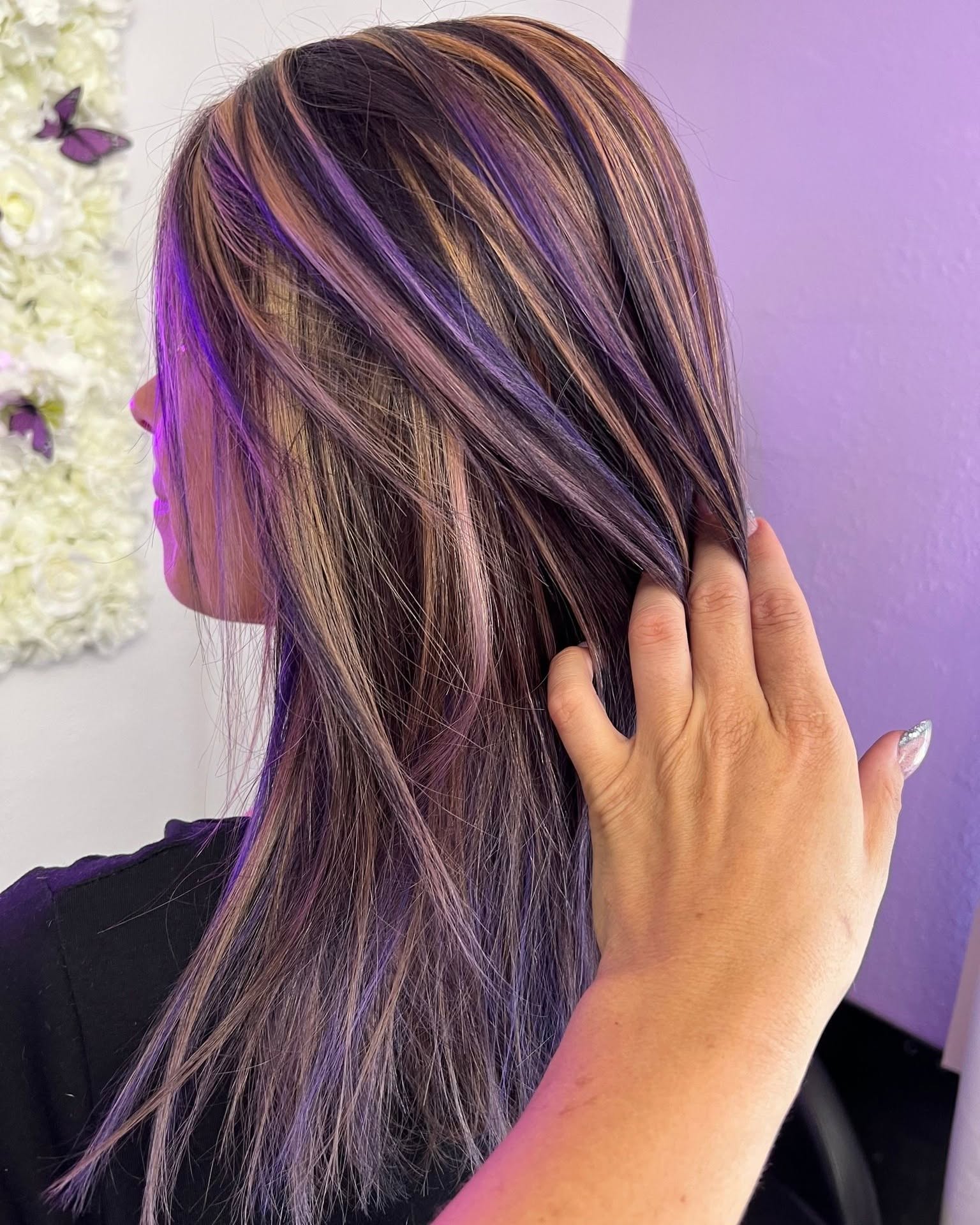 Long, voluminous hair extensions styled in soft waves